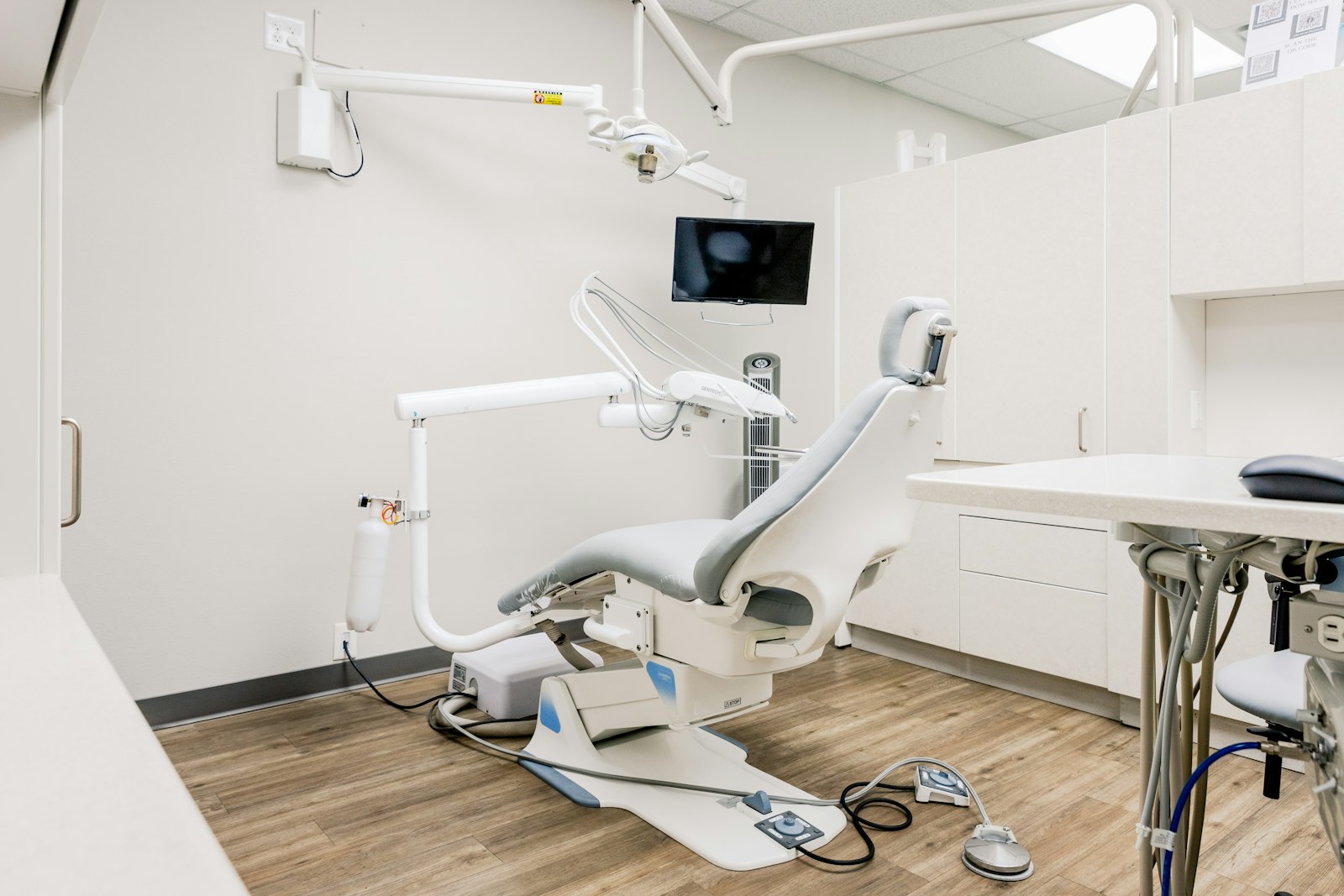 Modern dental treatment room with clean white interior