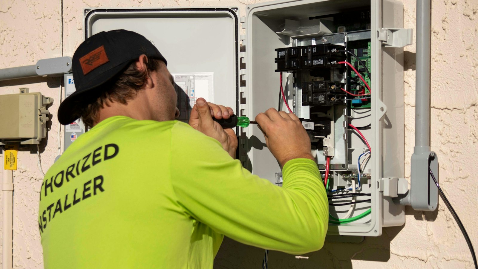Electrician working on home electrical panel